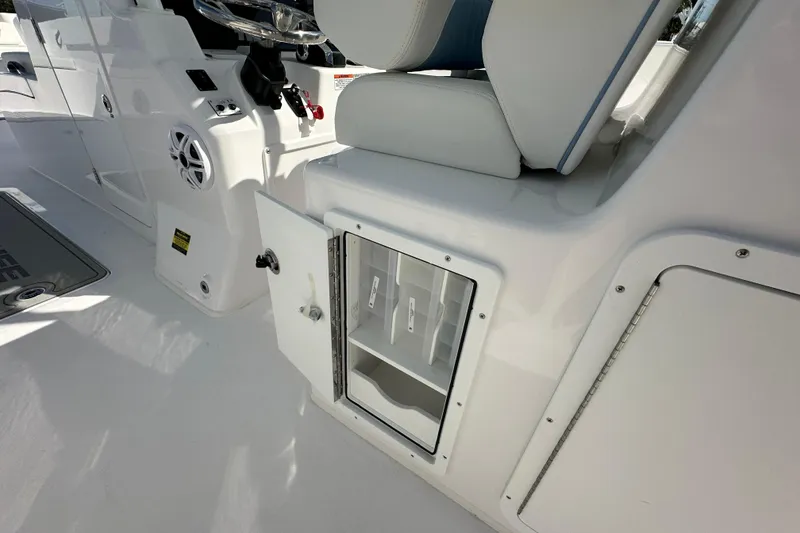 Slide: The Image of 2026 Twin Vee 340 GFX2 CC boat interior with storage compartment and seating. - 20