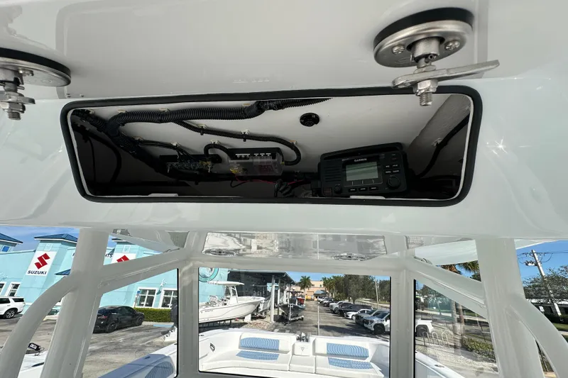Slide: The Image of 2026 Twin Vee 340 GFX2 CC boat interior with electronic equipment and wiring. - 22