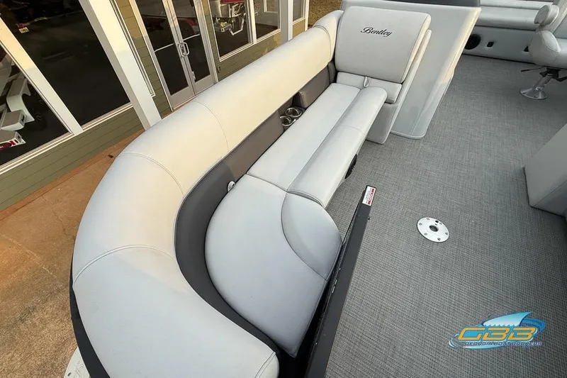 Slide: The Image of 2022 Bentley 243 Swingback boat interior with gray seating and carpet flooring. - 20