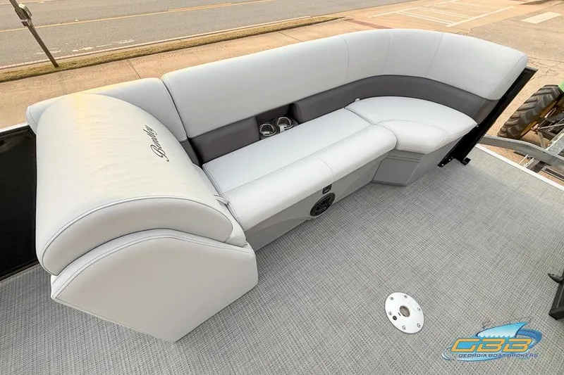 Slide: The Image of Luxurious seating on a 2022 Bentley 243 Swingback boat, featuring elegant upholstery and cup holders. - 21