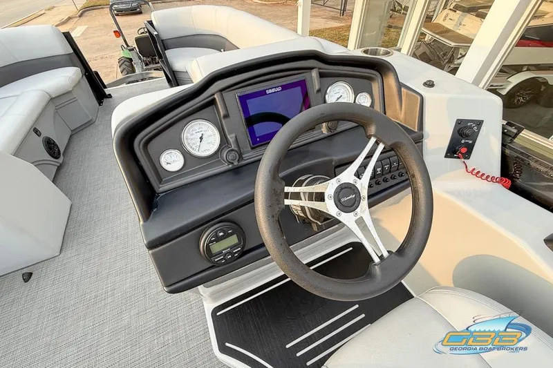 Slide: The Image of Interior view of 2022 Bentley 243 Swingback boat dashboard with steering wheel and gauges. - 22