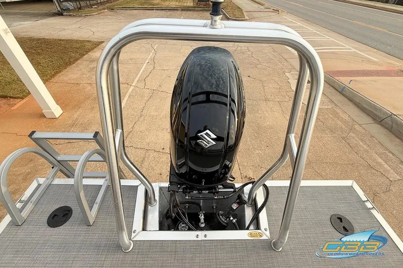 Slide: The Image of 2022 Bentley 243 Swingback boat with Suzuki outboard motor, viewed from the rear deck. - 29