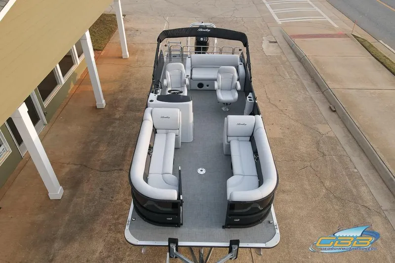 Slide: The Image of 2022 Bentley 243 Swingback pontoon boat with spacious seating and modern design. - 3