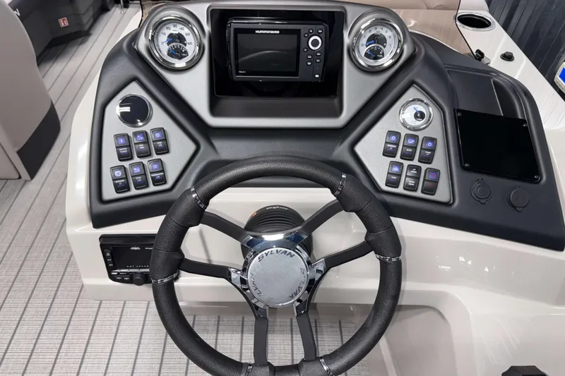 Slide: The Image of 2026 Sylvan L3 RLZ boat dashboard with steering wheel and control panel. - 12