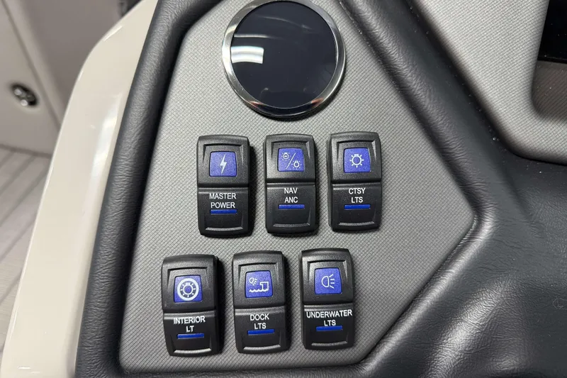 Slide: The Image of Control panel of 2026 Sylvan L3 RLZ boat with various switches. - 13