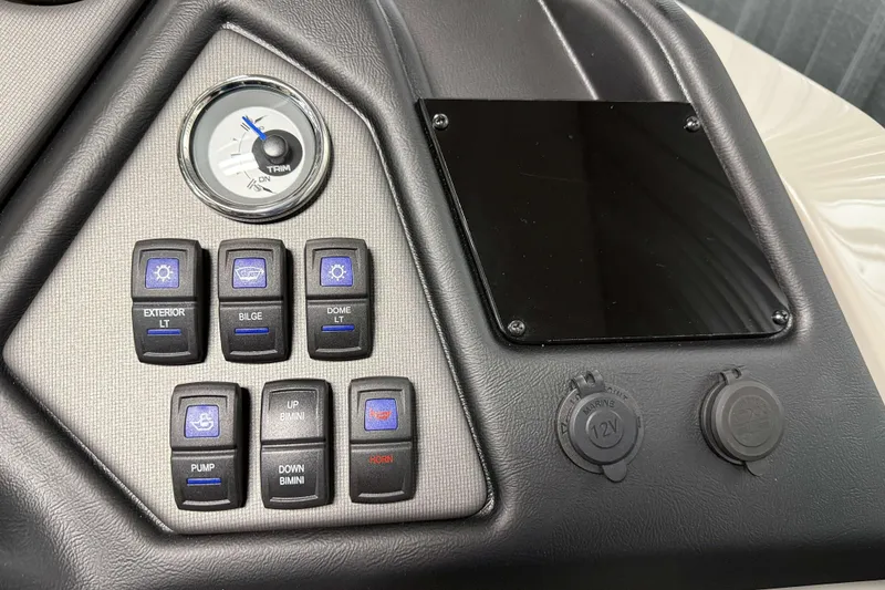 Slide: The Image of Control panel of 2026 Sylvan L3 RLZ boat with switches and trim gauge. - 15