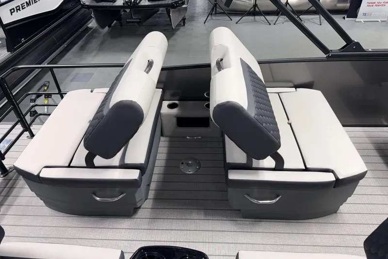 Slide: The Image of 2026 Sylvan L3 RLZ boat interior with dual seating and cup holders. - 18