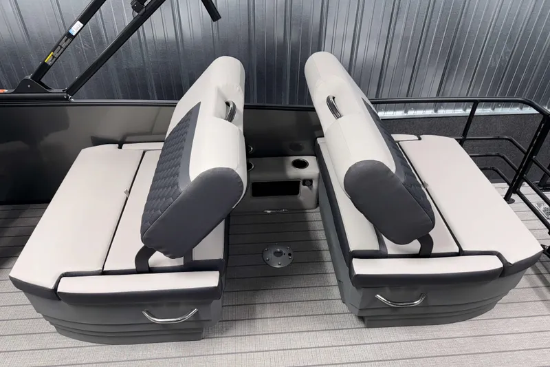 Slide: The Image of 2026 Sylvan L3 RLZ boat interior with dual gray and white cushioned seats. - 22