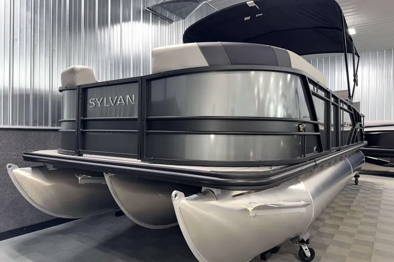 Slide: The Image of 2026 Sylvan L3 RLZ pontoon boat in showroom, featuring sleek design and modern amenities. - 28