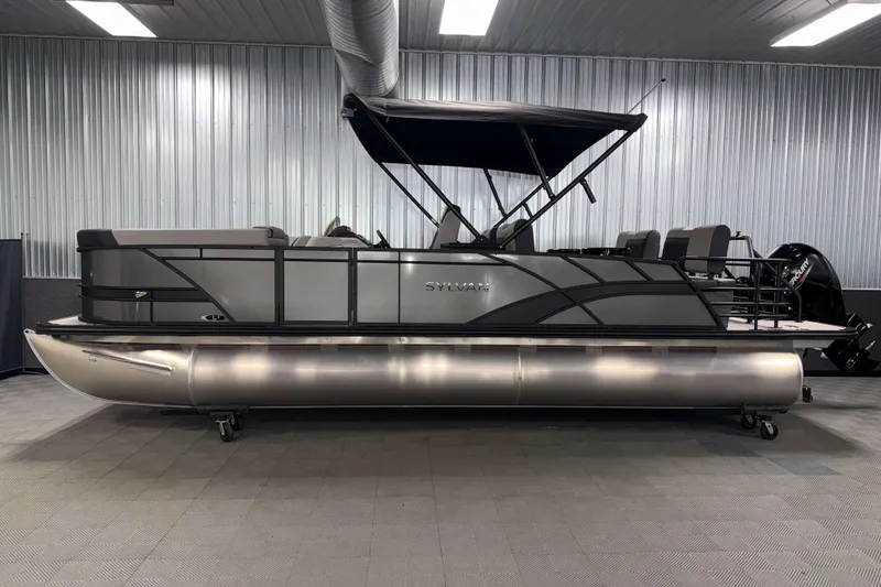 Slide: The Image of 2026 Sylvan L3 RLZ pontoon boat in showroom, featuring sleek design and modern amenities. - 30