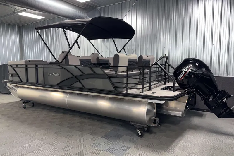 Slide: The Image of 2026 Sylvan L3 RLZ pontoon boat with Mercury outboard motor in a showroom. - 31