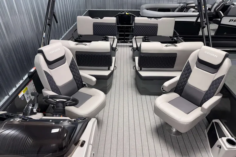 Slide: The Image of Interior of 2026 Sylvan L3 RLZ boat with modern seating and steering console. - 7