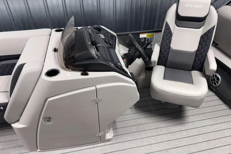 Slide: The Image of 2026 Sylvan L3 RLZ boat interior with modern helm and comfortable captain's chair. - 9