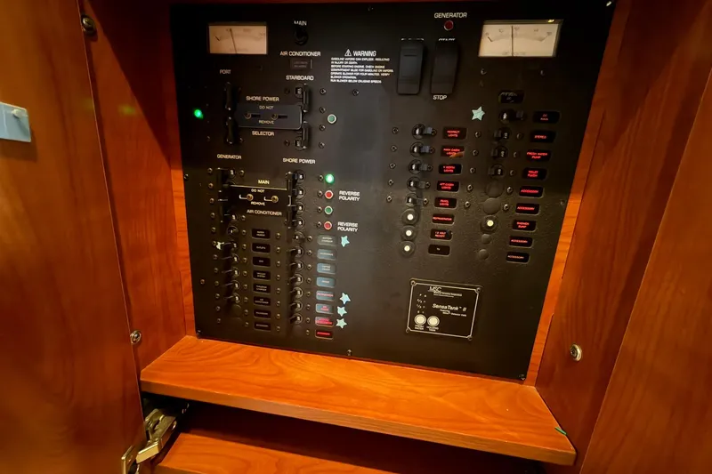 Slide: The Image of Electrical control panel on a 2007 Rinker 370 Express Cruiser Hard Top boat. - 21