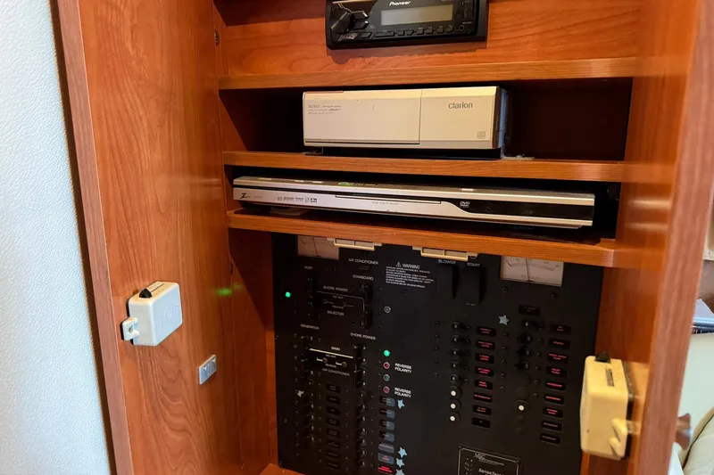 Slide: The Image of Control panel and audio system inside a 2007 Rinker 370 Express Cruiser Hard Top. - 22