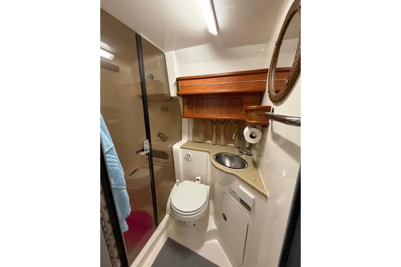 Slide: The Image of 2007 Rinker 370 Express Cruiser bathroom with shower, sink, and toilet. - 29
