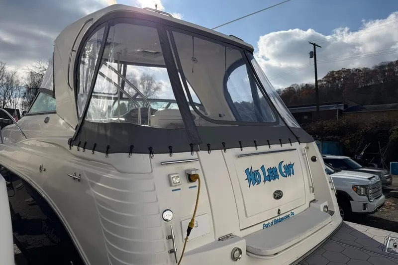 Slide: The Image of 2007 Rinker 370 Express Cruiser Hard Top in a marina setting, rear view. - 4