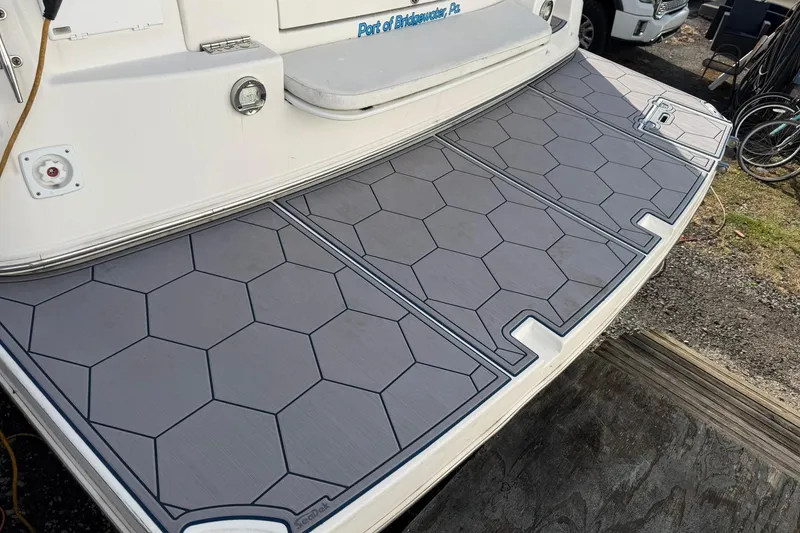 Slide: The Image of 2007 Rinker 370 Express Cruiser Hard Top with hexagonal deck padding. - 5