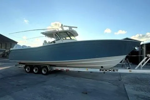 The Image of 2020 Grady-White Canyon 376 boat on trailer under cloudy sky. - 1