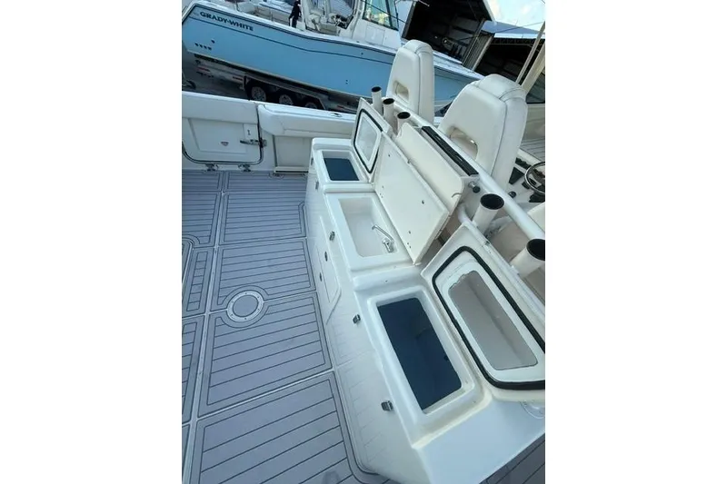 Slide: The Image of 2020 Grady-White Canyon 376 boat interior with steering console and seating area. - 10