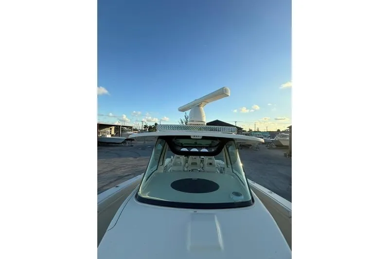 Slide: The Image of Control panel of 2020 Grady-White Canyon 376 boat with steering and switches. - 15