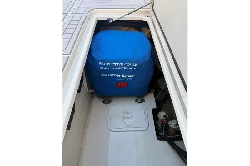 Slide: The Image of 2020 Grady-White Canyon 376 boat toilet with wooden flooring and fishing reel. - 26