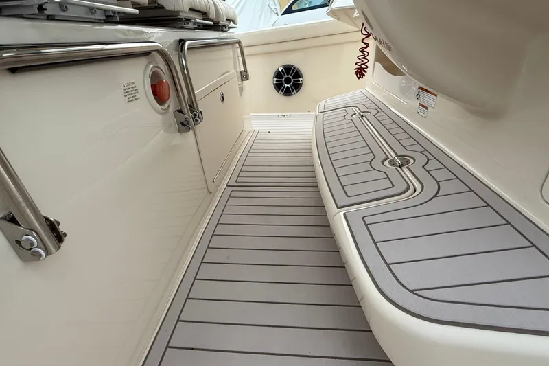 Slide: The Image of 2020 Grady-White Canyon 376 boat deck with sleek, modern design and storage compartments. - 28