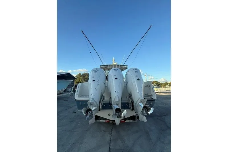 Slide: The Image of 2020 Grady-White Canyon 376 boat interior with spacious seating and deck, docked at marina. - 3