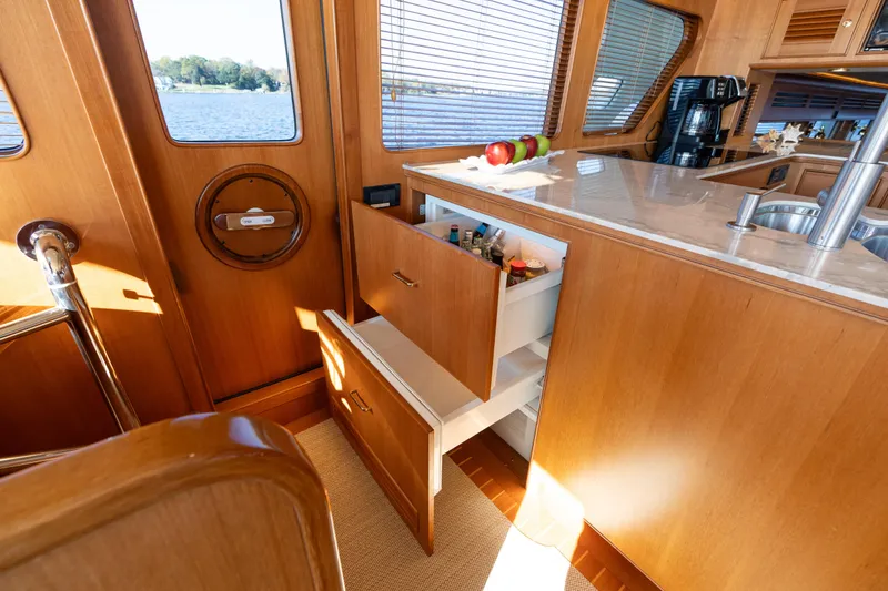 Slide: The Image of Marlow 72 GRIFFIN - Elevated Galley and Dining Storage - 49