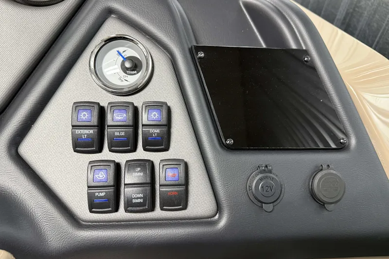 Slide: The Image of Control panel of 2026 Sylvan L3 RLZ boat with switches and 12V outlets. - 14