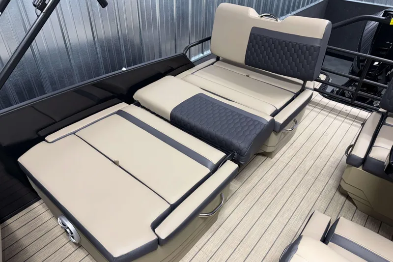 Slide: The Image of 2026 Sylvan L3 RLZ boat interior with beige and black cushioned seating. - 21