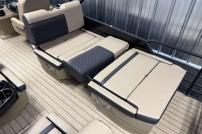 Slide: The Image of 2026 Sylvan L3 RLZ boat interior with beige and black seating, modern design. - 22