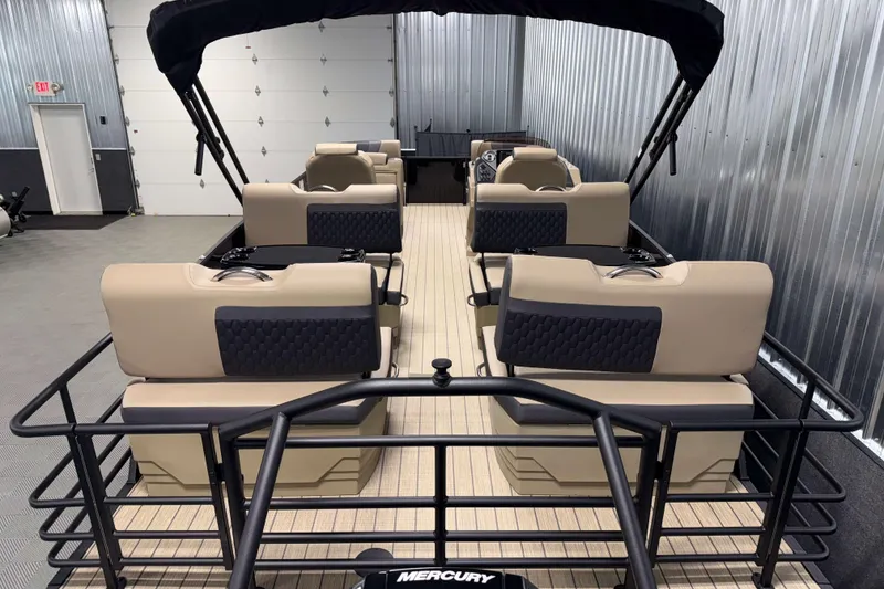 Slide: The Image of 2026 Sylvan L3 RLZ pontoon boat interior with beige seating and black accents. - 23
