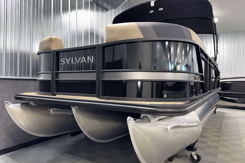 Slide: The Image of 2026 Sylvan L3 RLZ pontoon boat in showroom, sleek design, metallic finish. - 26