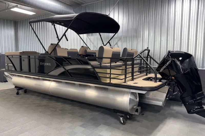 Slide: The Image of 2026 Sylvan L3 RLZ pontoon boat with Mercury outboard in a showroom. - 30