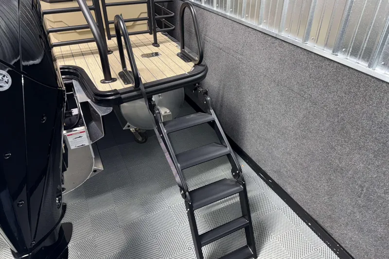 Slide: The Image of 2026 Sylvan L3 RLZ boat with rear ladder and deck view. - 31