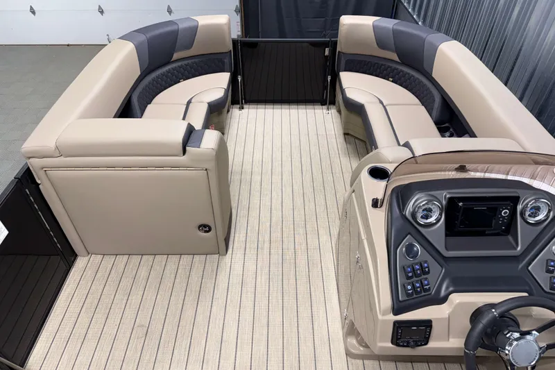 Slide: The Image of Luxurious interior of 2026 Sylvan L3 RLZ pontoon boat with plush seating and modern dashboard. - 6