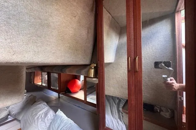 Slide: The Image of Interior of 1987 Carver 32 Aft Cabin Motor Yacht with cozy cabin and storage. - 49