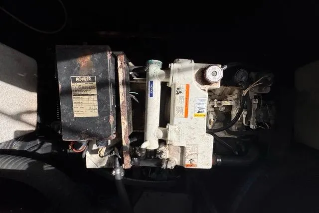 Slide: The Image of Engine compartment of 1987 Carver 32 Aft Cabin Motor Yacht with Kohler generator. - 76