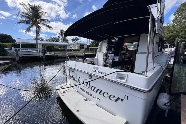 Slide: The Image of 1987 Carver 32 Aft Cabin Motor Yacht docked, featuring "Flash Dancer II" name, Palm Beach, FL. - 8