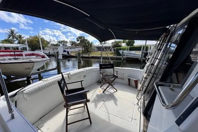 Slide: The Image of 1987 Carver 32 Aft Cabin Motor Yacht with spacious deck and seating area. - 14