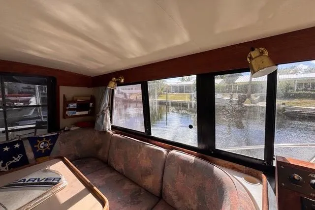 Slide: The Image of Interior of 1987 Carver 32 Aft Cabin Motor Yacht with waterfront view. - 29