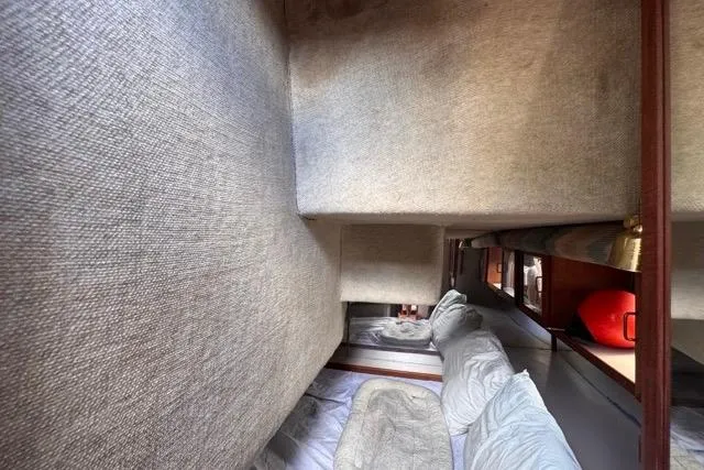 Slide: The Image of Interior cabin of 1987 Carver 32 Aft Cabin Motor Yacht with cozy bedding. - 48