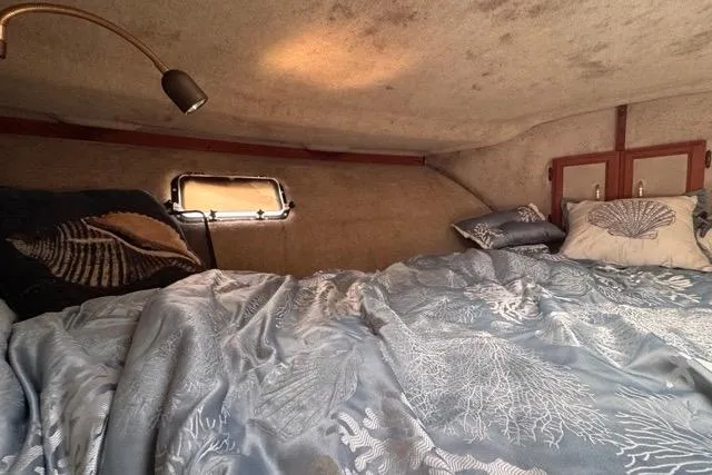 Slide: The Image of Cozy cabin interior of 1987 Carver 32 Aft Cabin Motor Yacht with nautical bedding. - 55
