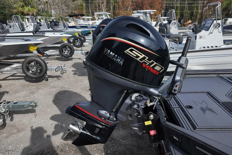 Slide: The Image of 2026 Xpress X18DB boat with Yamaha SHO VMAX outboard motor in a dealership lot. - 11