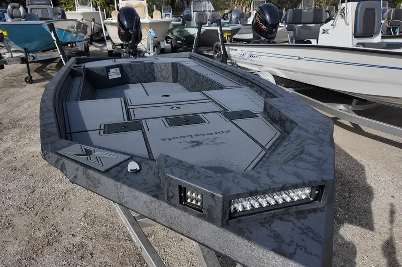 Slide: The Image of 2026 Xpress X18DB boat with sleek design and advanced features, displayed outdoors. - 3