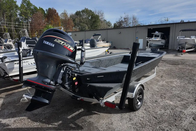 Slide: The Image of 2026 Xpress X18DB boat with Yamaha engine in a dealership lot. - 4