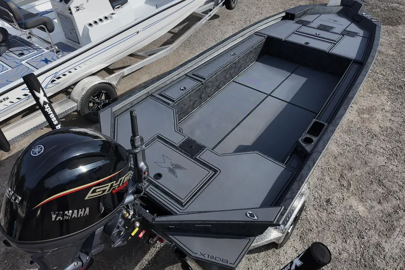 Slide: The Image of 2026 Xpress X18DB boat with Yamaha engine, sleek design, and spacious deck. - 5