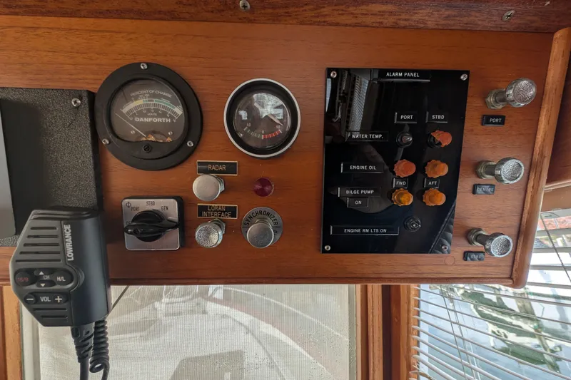 Slide: The Image of Control panel of a 1988 Grand Banks 46 Classic boat with gauges and switches. - 20