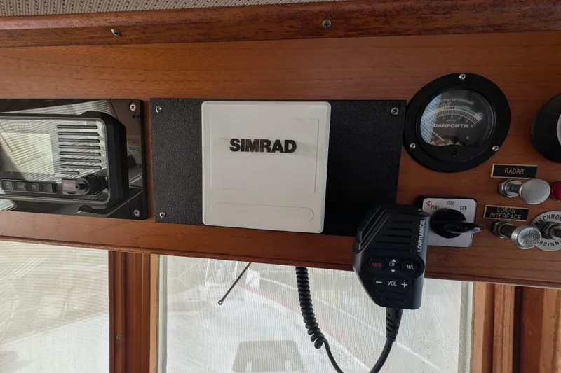 Slide: The Image of Control panel of a 1988 Grand Banks 46 Classic with Simrad equipment. - 21